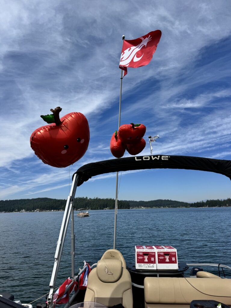 Apple and Cougar-themed boat on Loon Lake