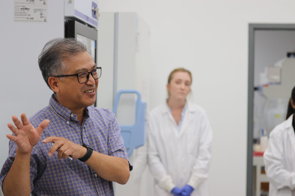 Dr. Zhao speaking with a tour group.