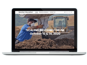 Laptop with "Scaling Biochar Forum" text on a website.