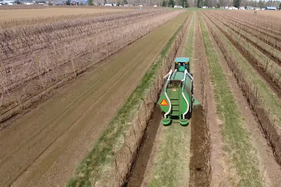 Computer-generated illustration of farm equipment operating.