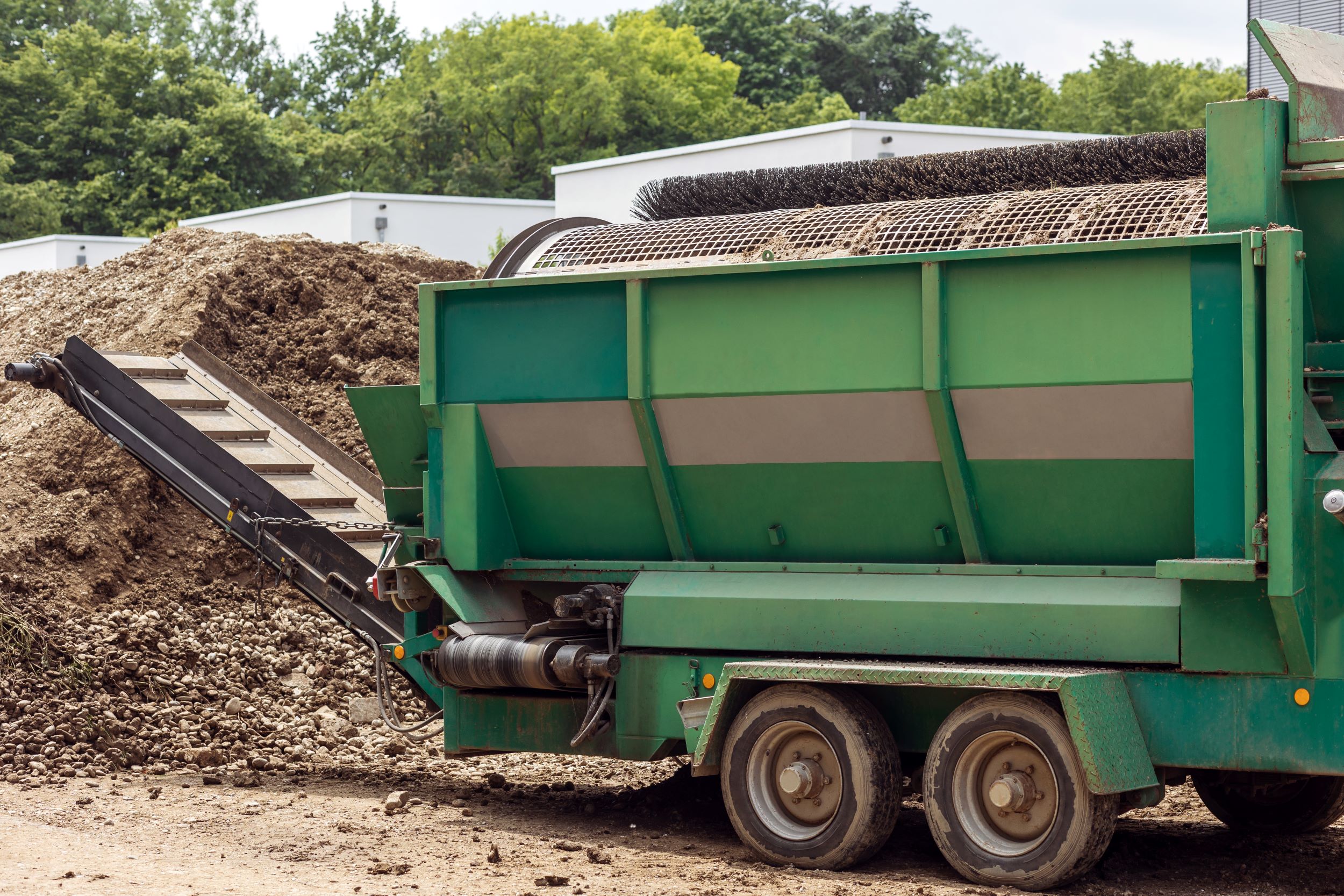 Industrial trailer full of compost in a waste yard