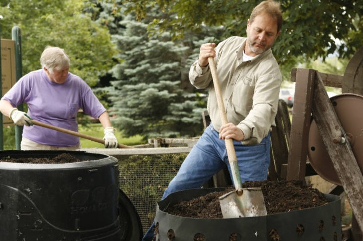 Master Gardeners mixing compost