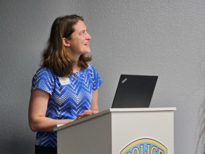 Georgine Yorgey stands at a podium.