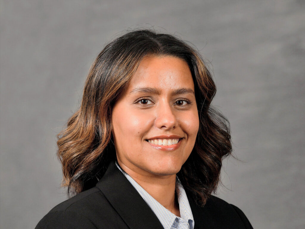 Professional headshot of young person.