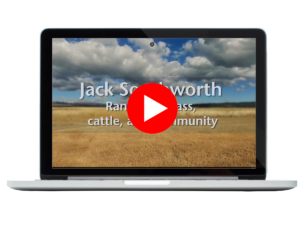 Video screenshot superimposed on laptop image.