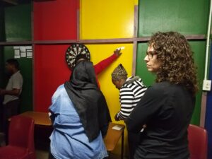 Picture of woman looking off camera and people in the background.