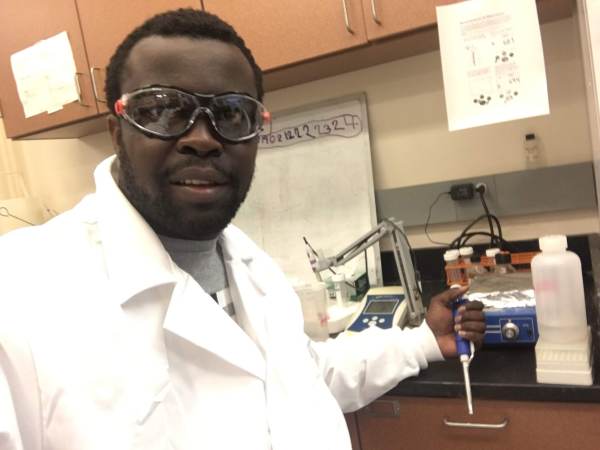 scientist in a white coat in the lab
