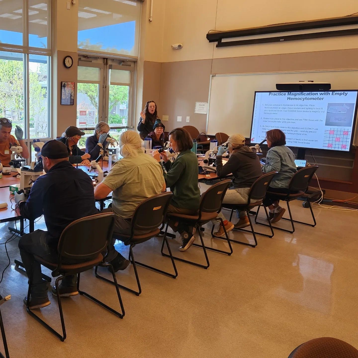 Bri Price talking to group at diagnostic microscopy workshop