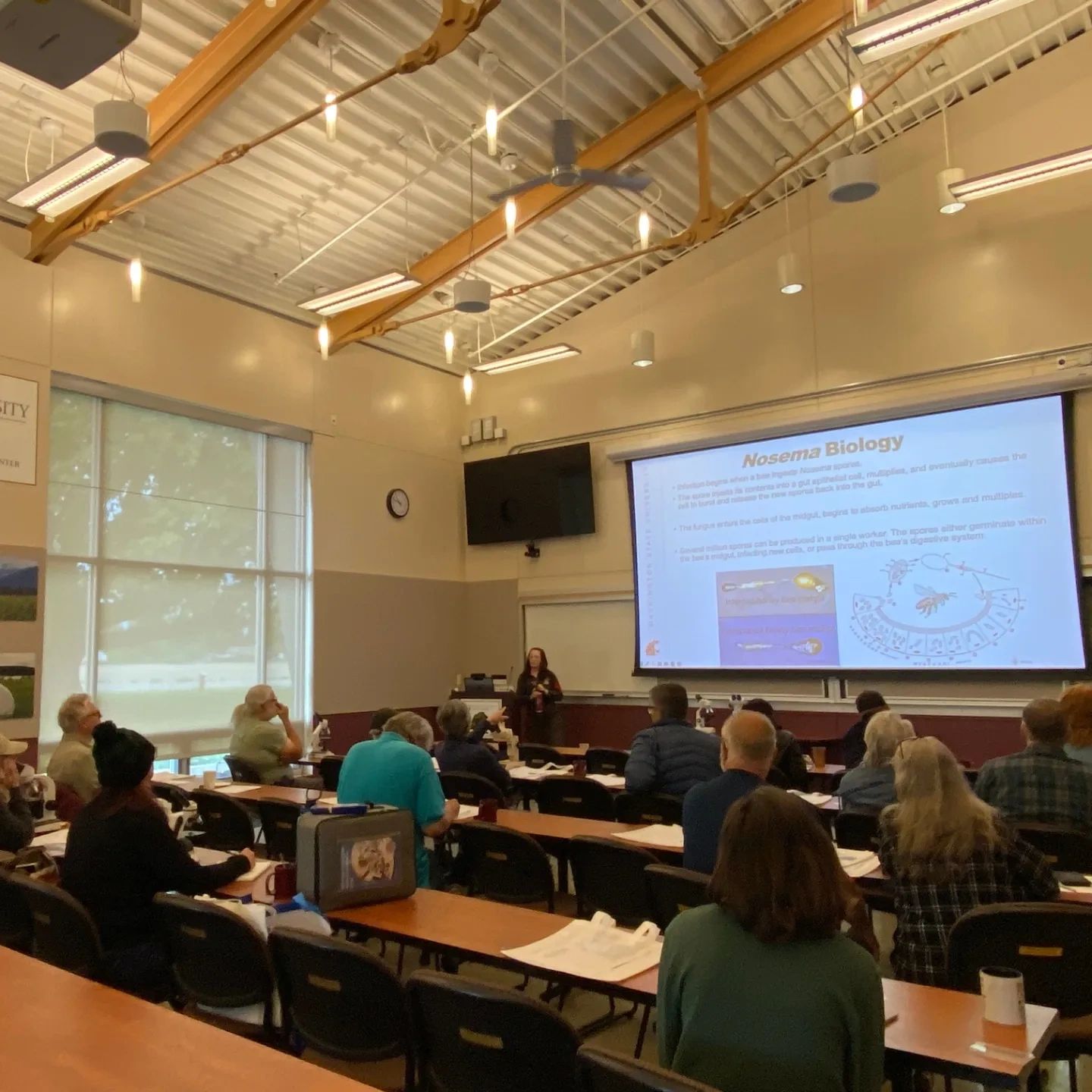 Bri Price talking to group at diagnostic microscopy workshop