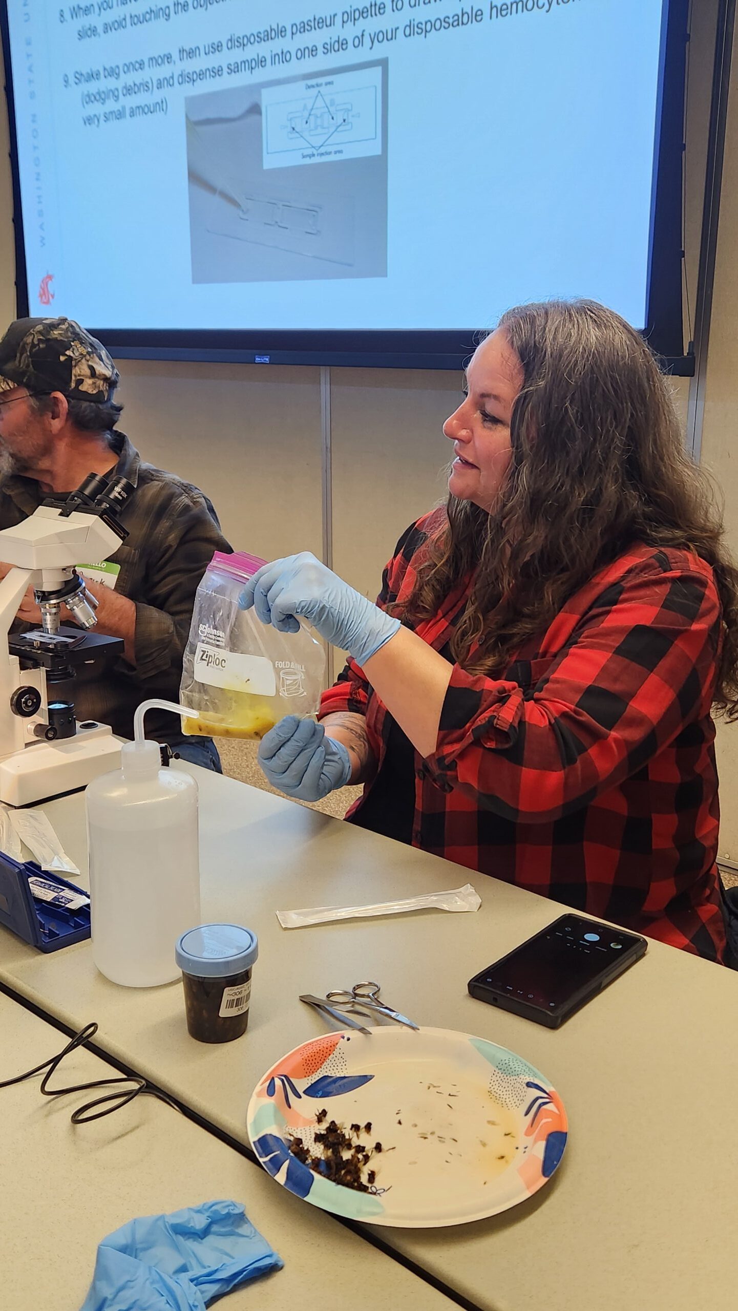 beekeeper holding bag of water and macerated honey bee abdomens 