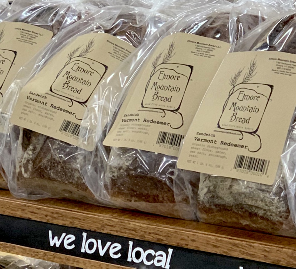 Several loaves of bread laying side by side.