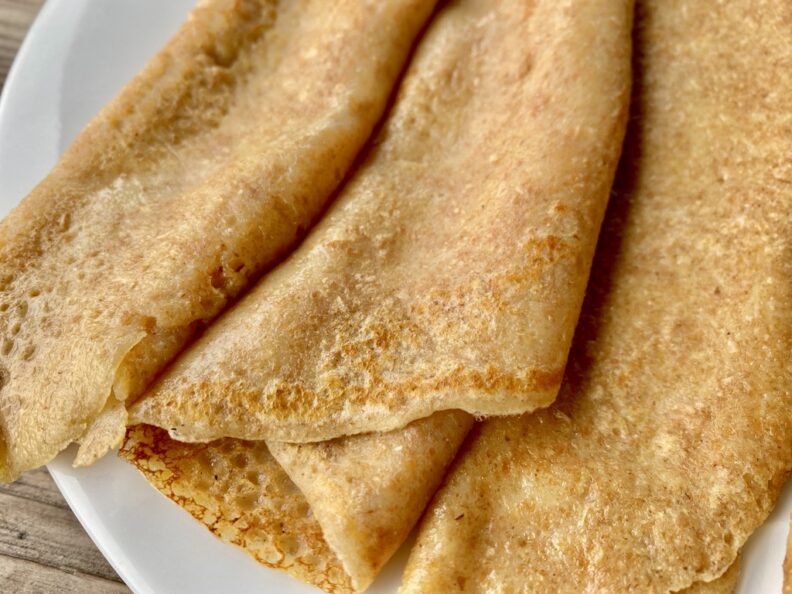 Crepes rolled up on a plate