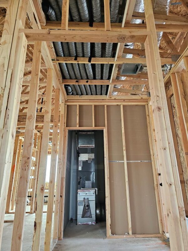 A newly constructed house with framing complete