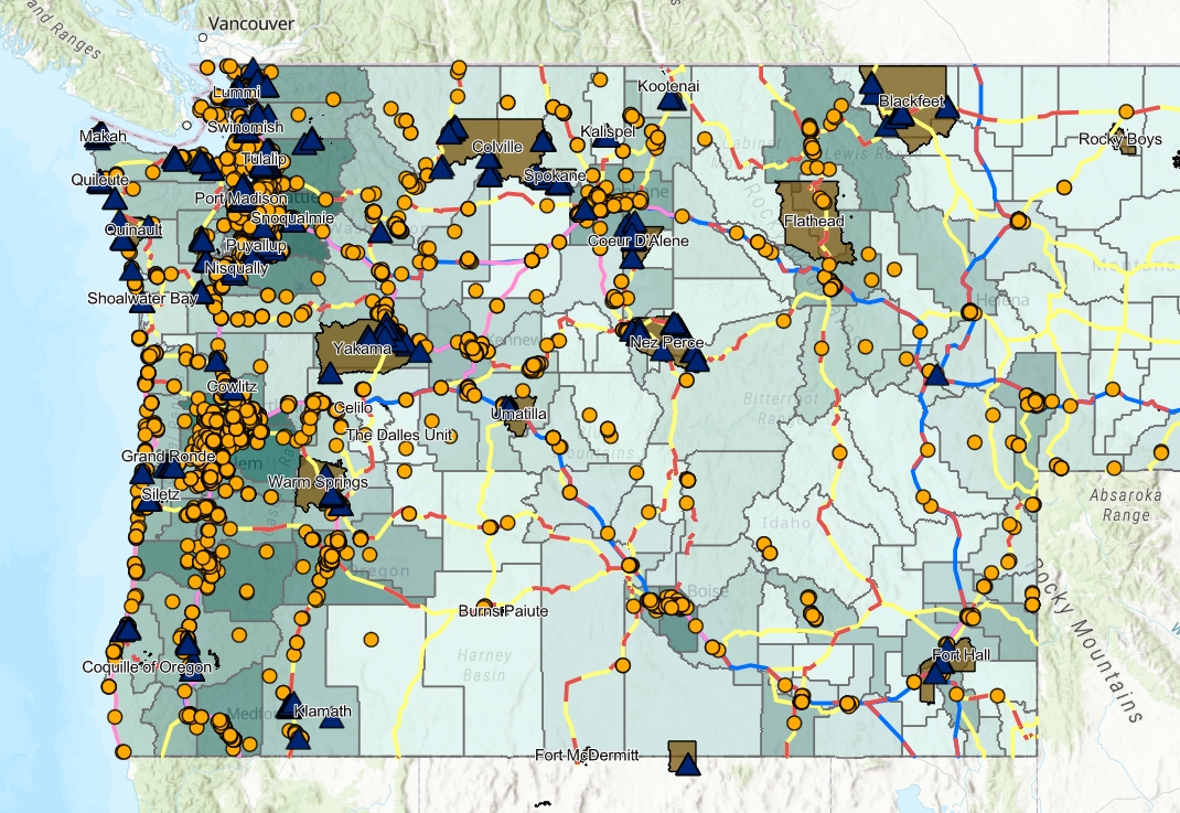 A screenshot of the mapping tool that shows a map of Washington, Idaho, Oregon, and Montana, with circles highlighting EV Charging stations, and other symbols noting Tribal land and points of interests, as well as state roads.