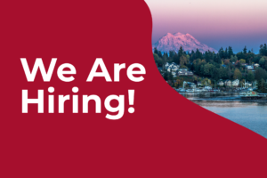 A banner that reads "we are hiring!" with an image of Olympia in the background.