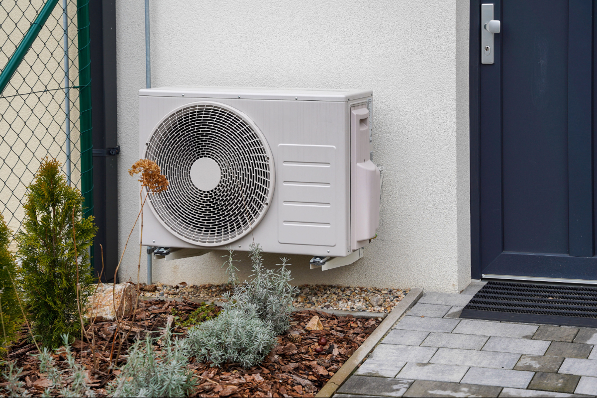 A heat pump outside a residential home
