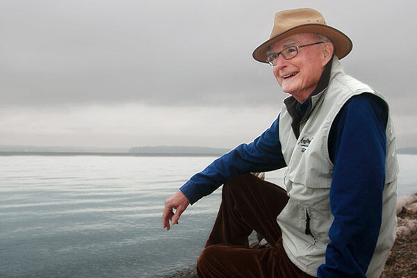 Bill Ruckelshaus smiling in front of the Puget Sound.