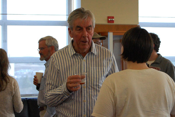 The lecturer has a conversation with a woman.