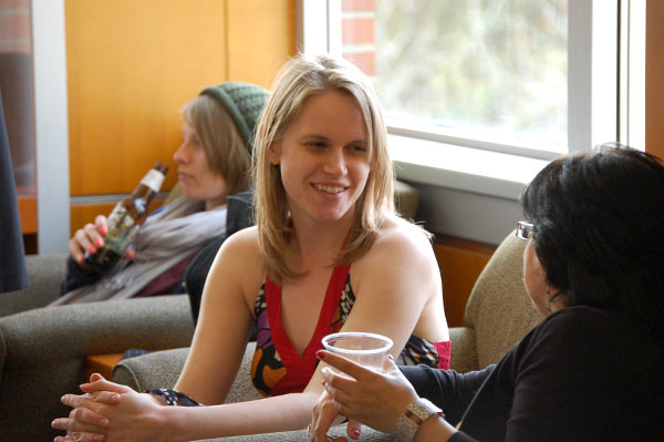 Two women talk together.