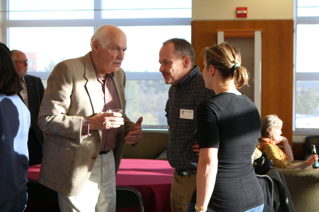 Faculty and students socializing