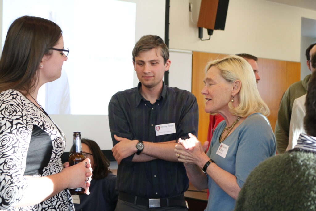 Beers speaking with students