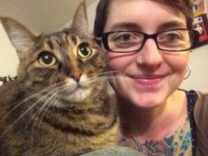 Rae Olsson with a cat.