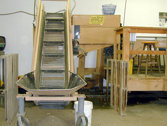 A picture of an elevator to a potato wash table.