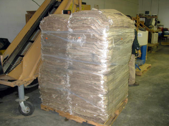 A picture of burlap bags wrapped in seran wrap.