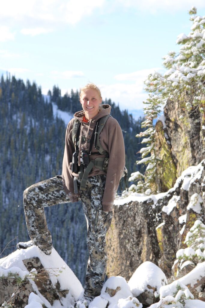 Photo of Athena Gates, M.S. 2019. Photo by Jordan Flanagan. The photo shows Athena Gates in hunting camo on a deer hunt near Baker City, Oregon