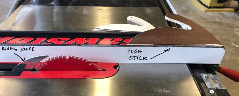 Photograph of the table saw, riving knife location, and the push stick. Image links to larger version.