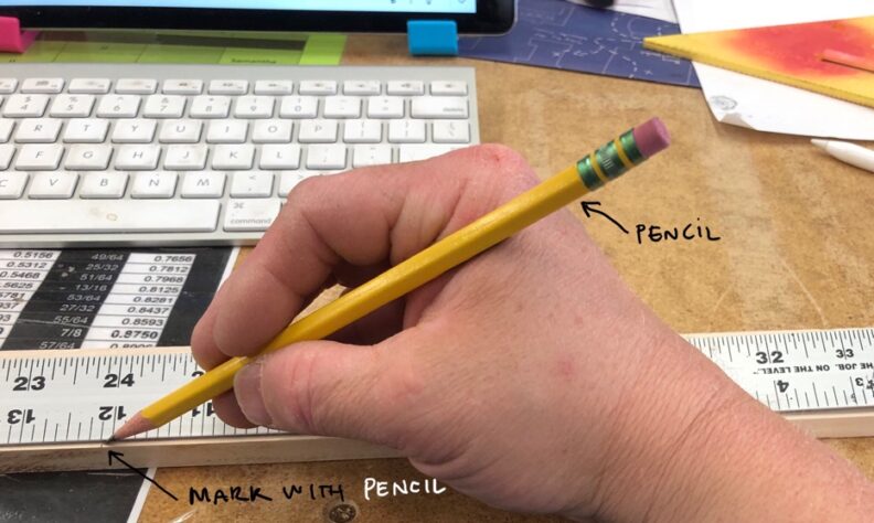 Marking the cut material at 12 inches with a pencil. Image links to larger version.