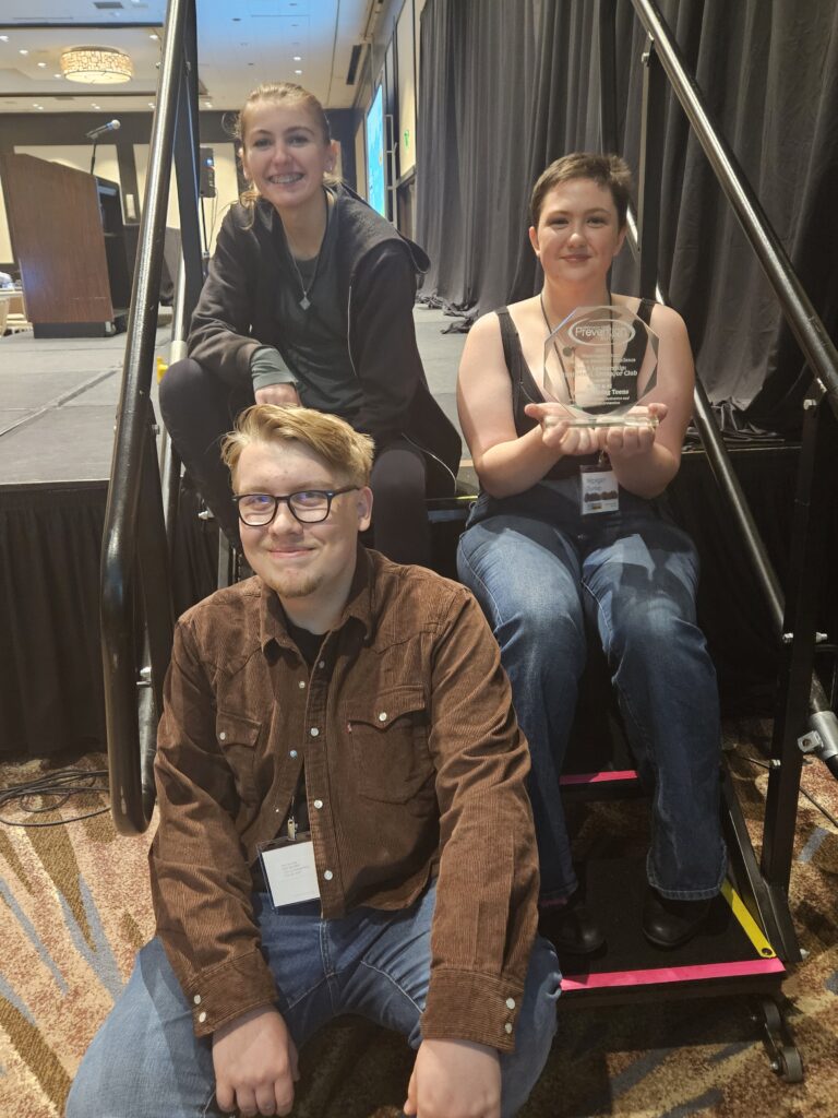 Proud teens show off their leadership award 