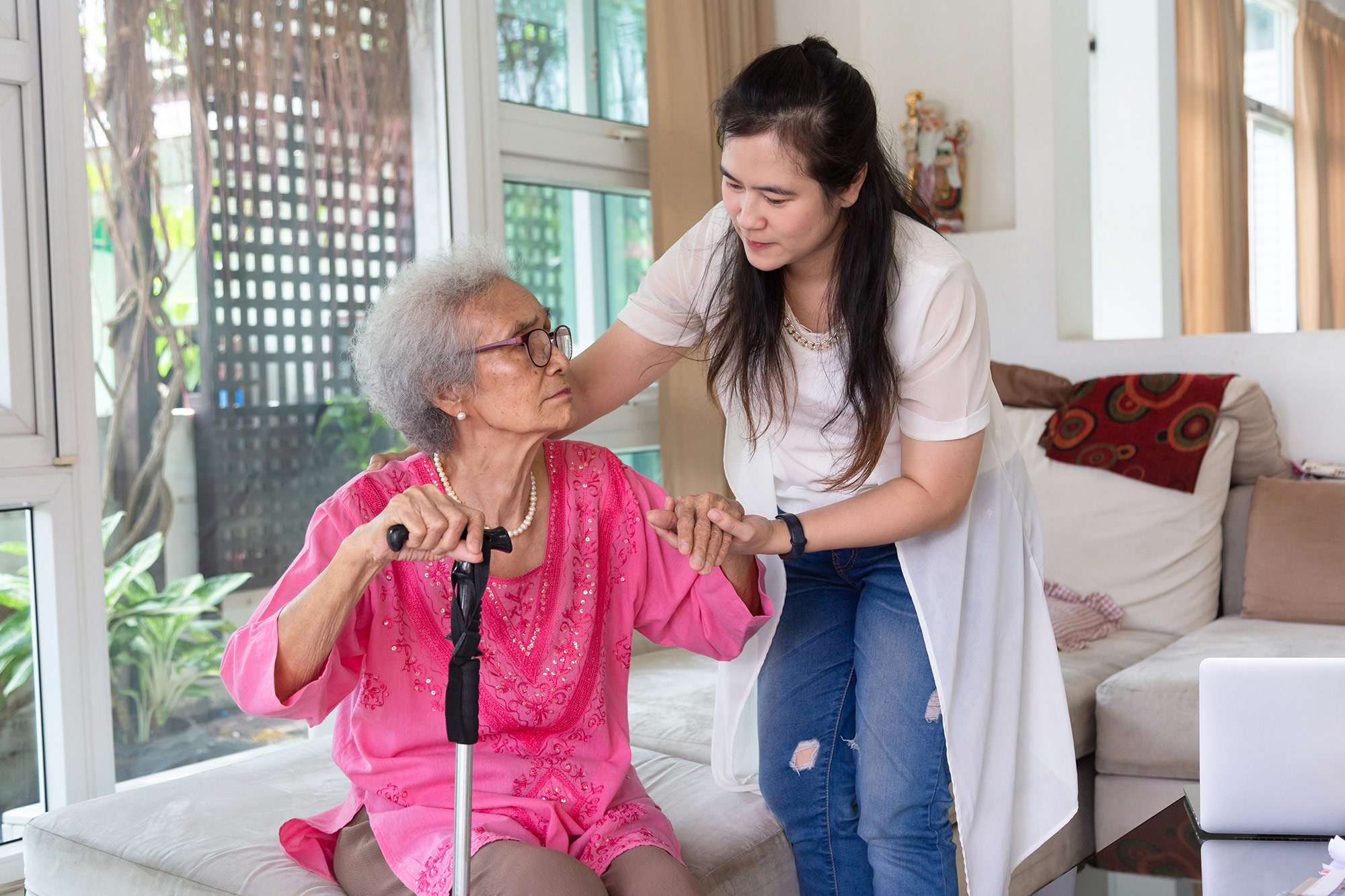 Female caregiver with elderly woman