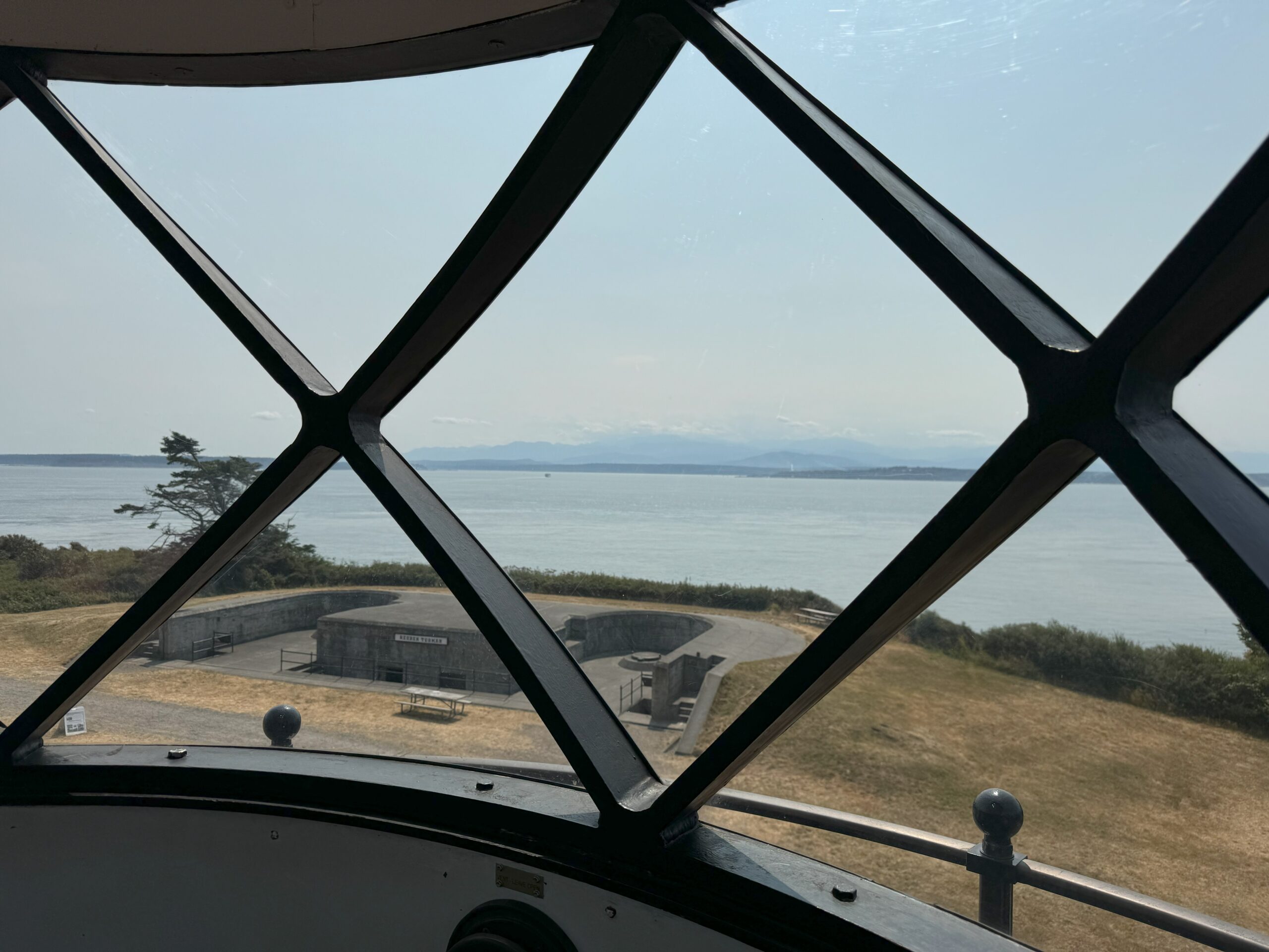 view from a lighthouse overlooking parts of Fort Casey and the ocean
