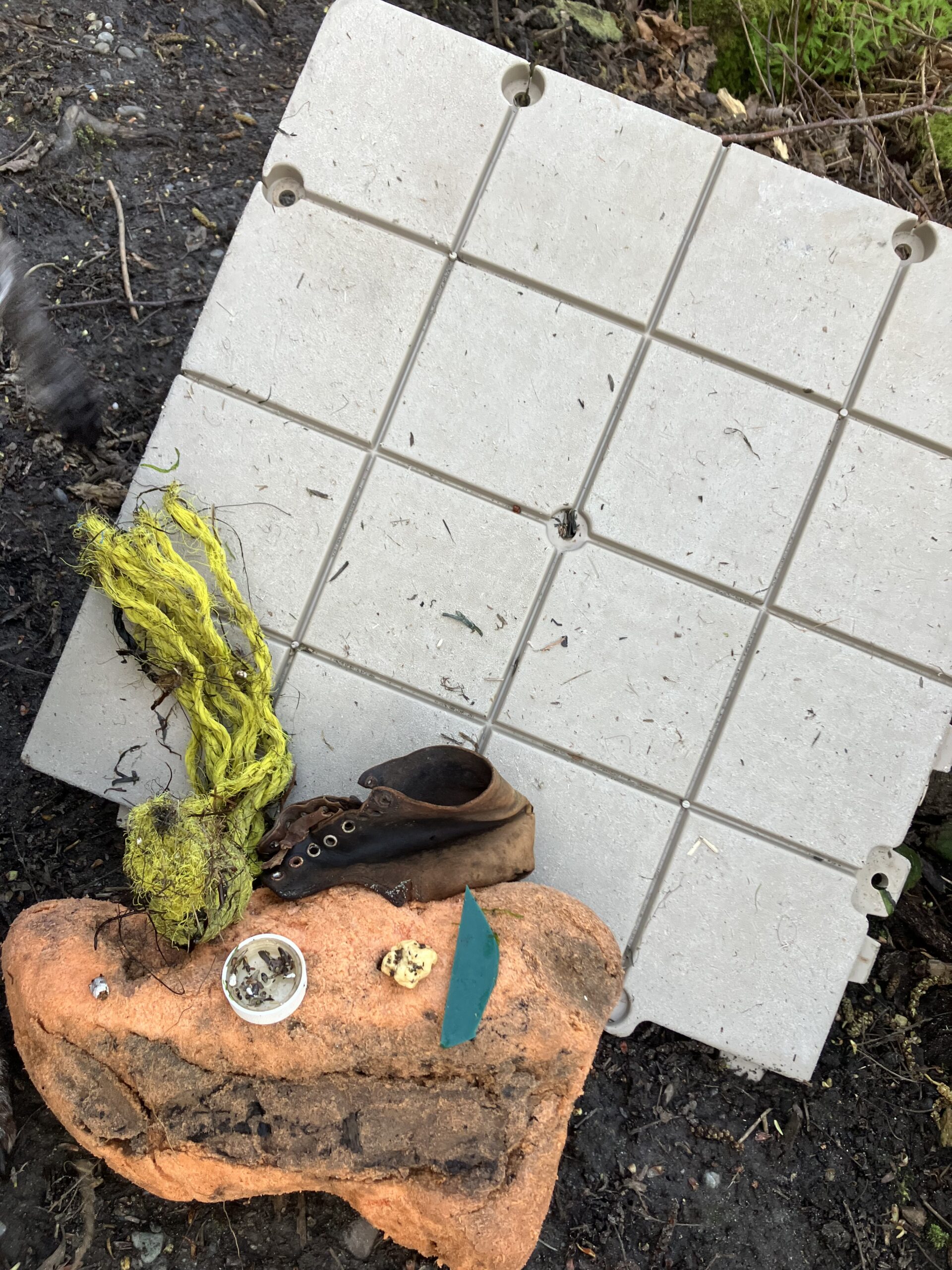 photo showing some of the litter that was picked up, including a shoe, tile, and rope