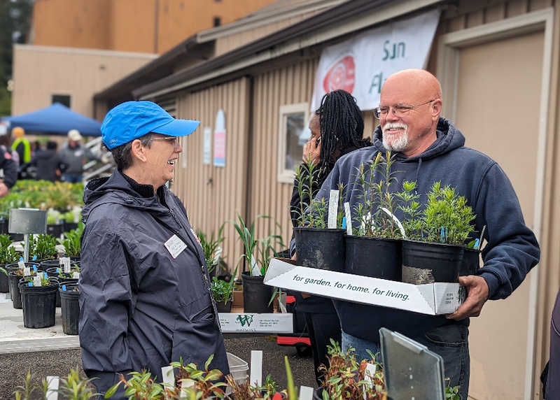 Man carrying plants.