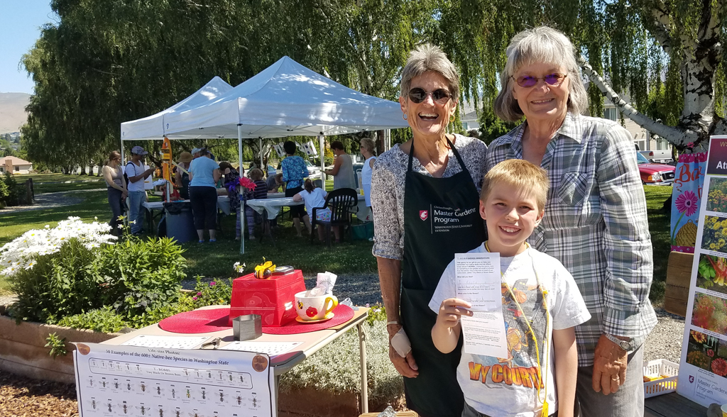 Two master gardeners talking about plants.