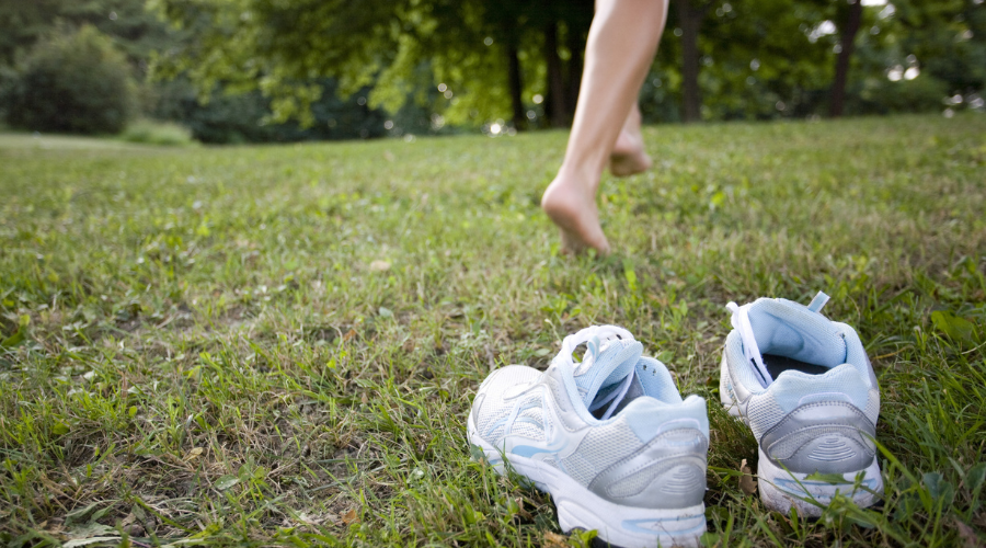 Person running over grass.