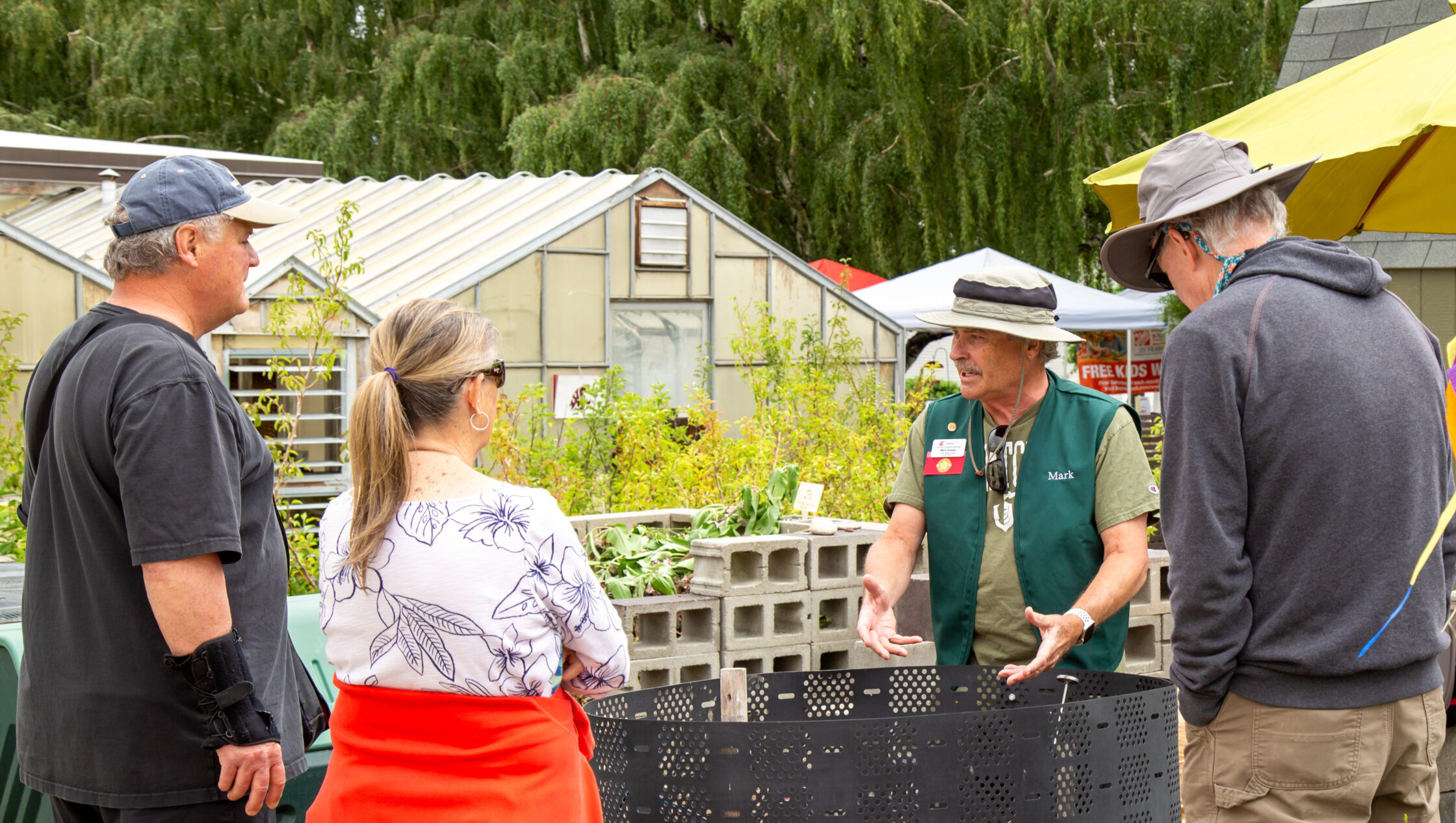 Master Gardener teaching a group about composting.