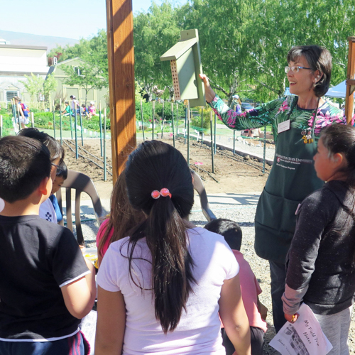 Two master gardeners talking about plants.