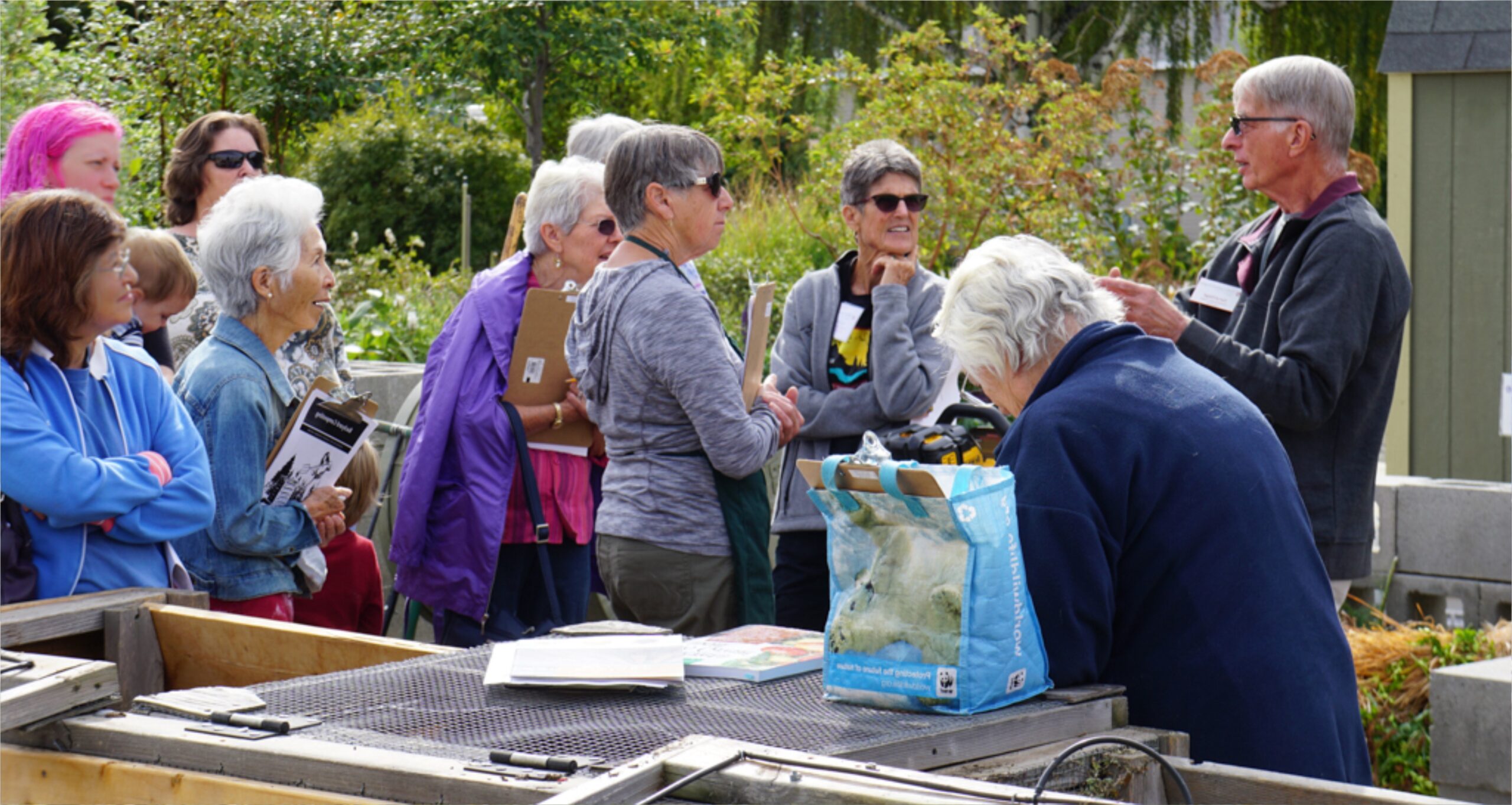 Master Gardener teaching class about composting in outdoor classroom