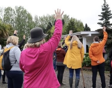 Volunteers raising their hands