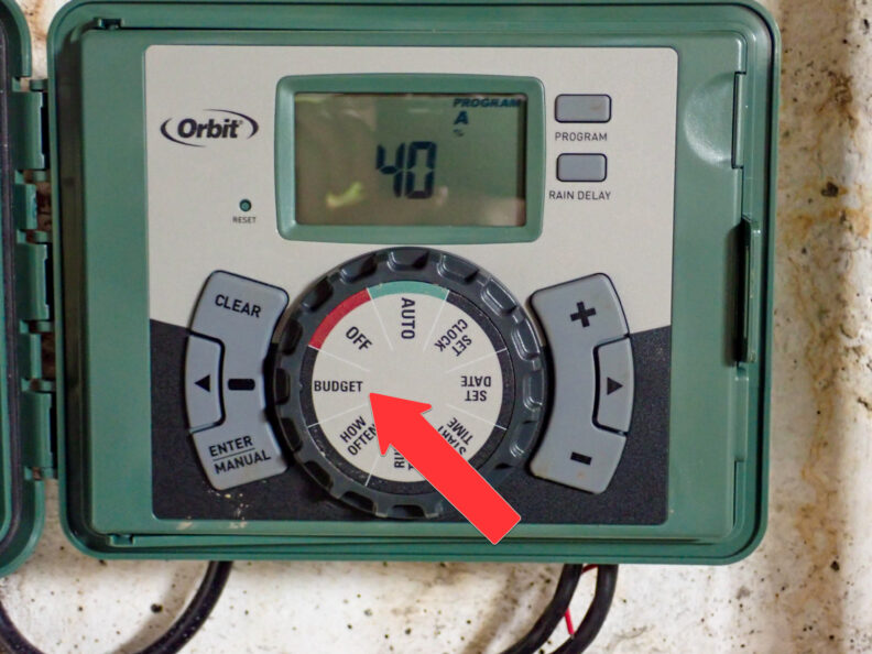 An Orbit brand sprinkler irrigation controller showing the "Budget" setting.