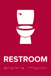 Crimson "Restroom" sign.