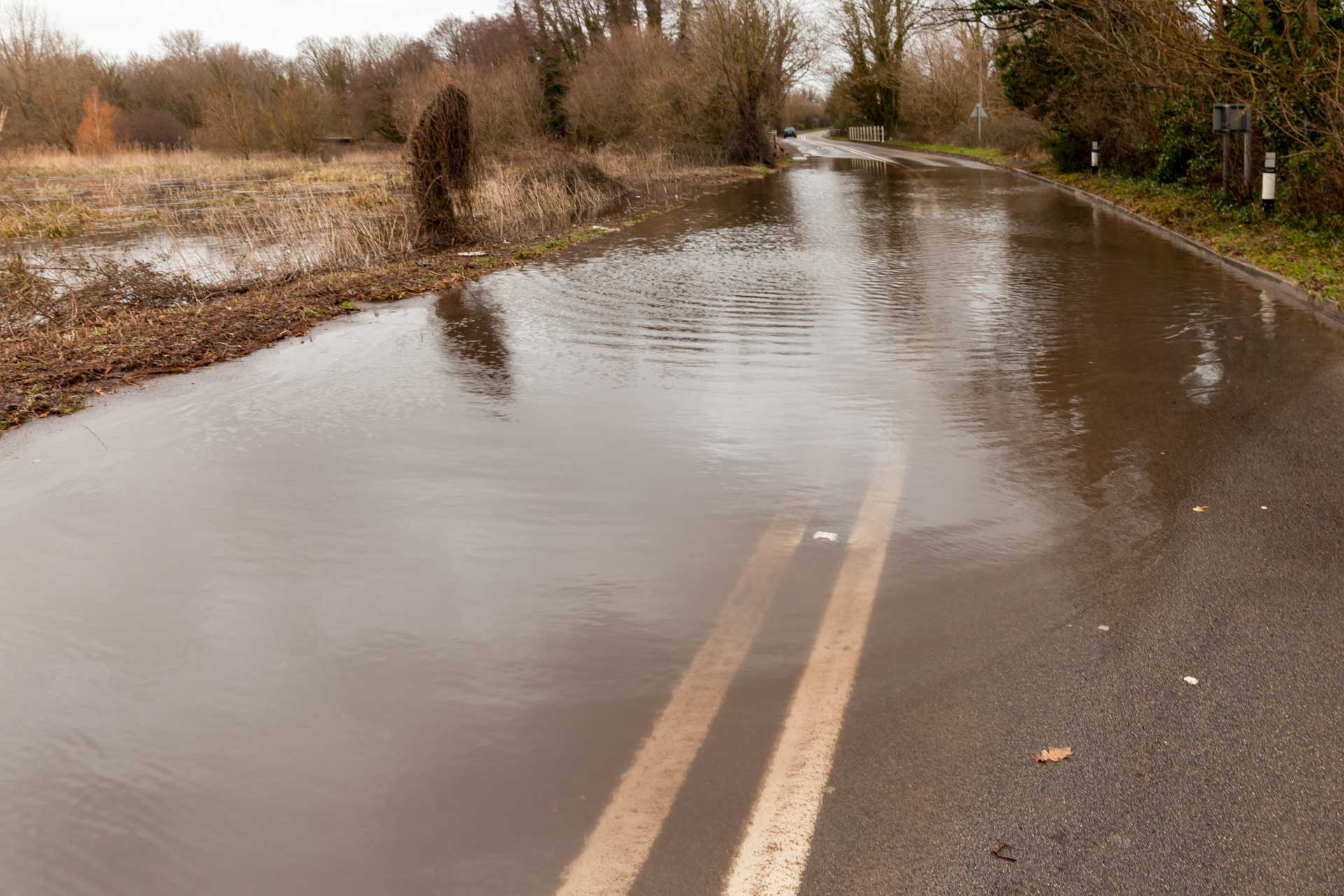 Flooding over a two lane road.