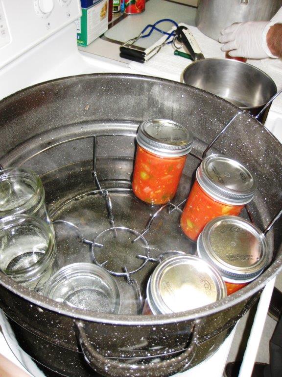Jars resting in a water bath canner