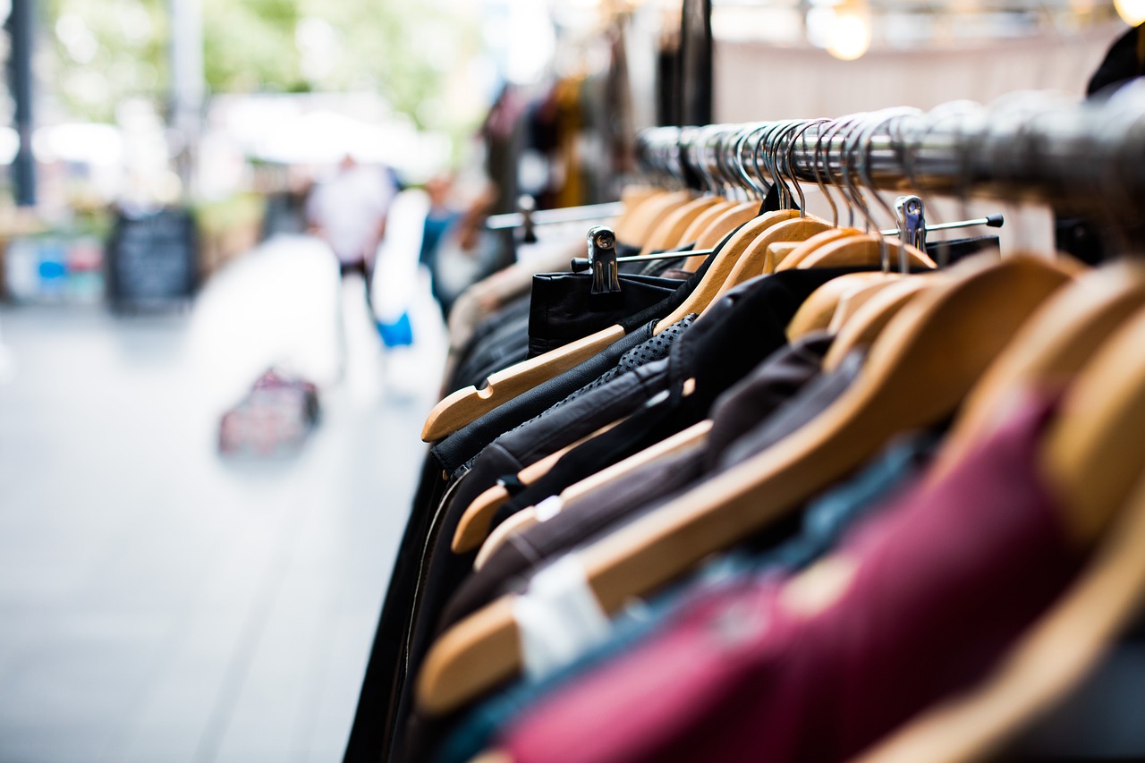 Garments on a rack outside running the depth of the photo with the focus on the mid-ground.