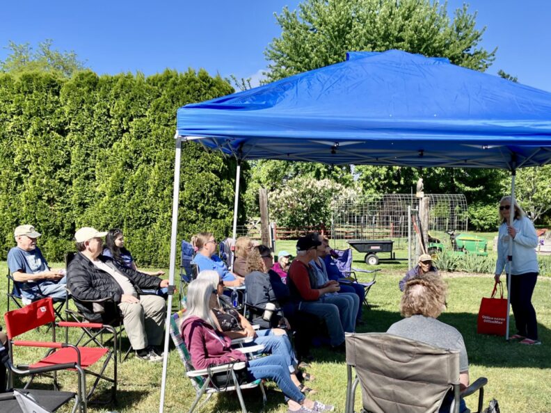 Master Gardener teaches a small group at the West Valley Food Garden.
