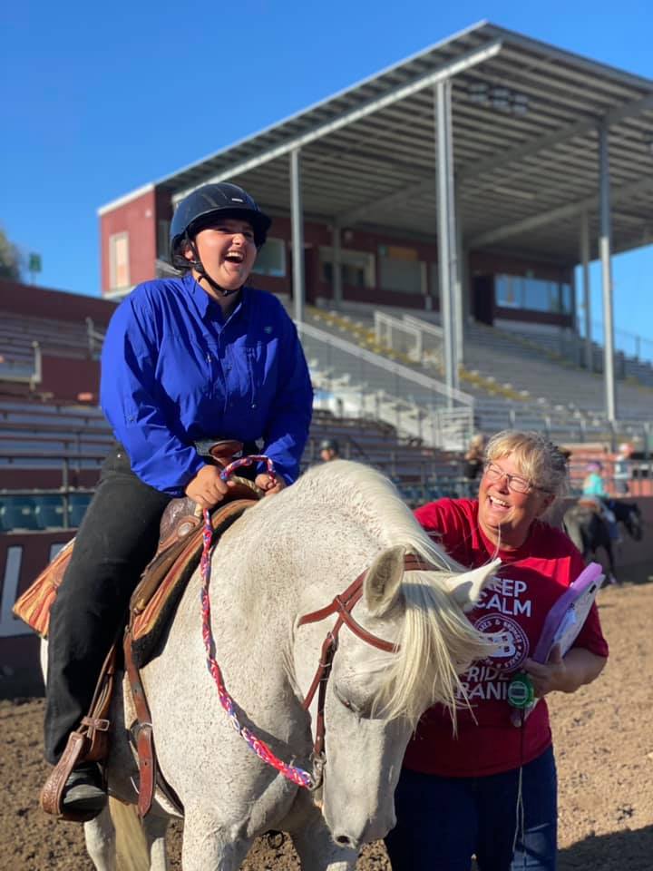4-H Volunteer and Horse Member Laughing