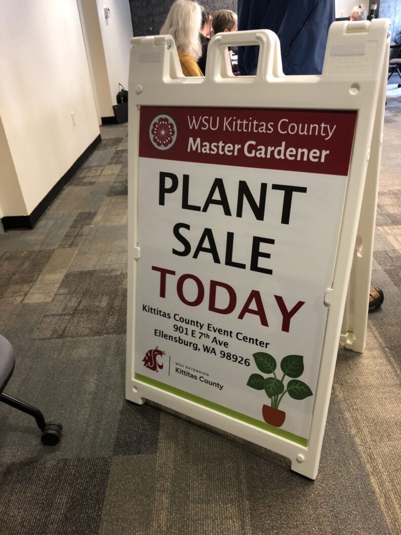 Sign reading "plant sale today" for the annual Master Gardener Plant Sale.